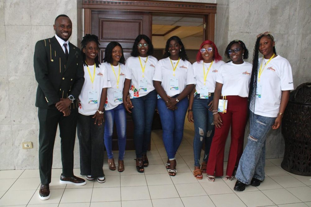 Better World Charity volunteers with a member of the team